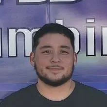Damian Chavez in front of the StormWaters van.